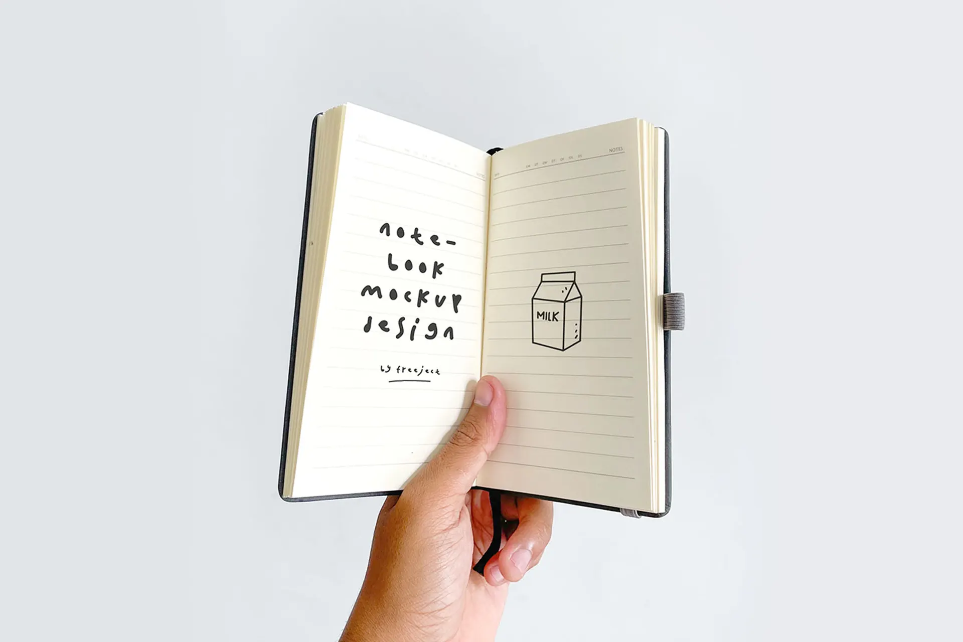 Free Hand Held Notebook PSD Mockup